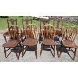 A set of four Edwardian dining chairs, together with a set of four wheelback oak chairs, each