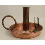 A large copper and brass chamberstick, with ring handle and match box holder, marked C Farris