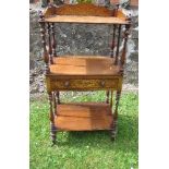 A 19th century three tier Canterbury, fitted with an inlaid drawer and supastructure, supported by