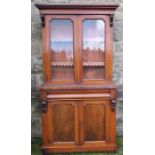 A Victorian mahogany glazed cabinet, the upper section having a pair of glazed doors and