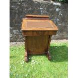 A late 19th century burr walnut Davenport, having stationery section, rising lid and drawers