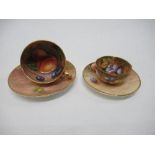 Two miniature Royal Worcester cups and saucers, decorated with hand painted fruit by Mabery and