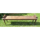 A 19th century oak bench, with cluster roll ends, raised on turned  legs, width 66ins