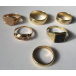 A collection of six 9 carat gold rings, comprising, three wedding rings, an onyx ring, a signet
