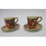 Two Royal Worcester coffee cans and saucers, decorated all around with hand painted fruit by Freeman