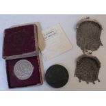 Two hallmarked silver mesh purses, together with a cased 1951 Festival of Britain coin and a