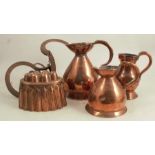 A collection of copper items, to include a jelly mould, a pint and a quart jug, another measure