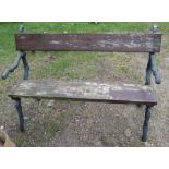 A Coalbrookedale style garden bench, the painted metal ends formed as branches, with wooden seat and