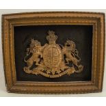 A 19th century gilt metal Royal Coat of Arms, framed, overall 12ins x 15ins