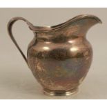 A silver jug, London 1939, weight 6oz