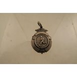 A hallmarked silver football medal, inscribed to the reverse, RSL winners 1953/54 J Curley