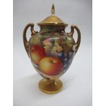 A Royal Worcester covered vase, decorated half round with hand painted fruit by Ayrton, to gilt