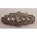 An Art Deco rose diamond set panel brooch, set with fifteen stones, mount unmarked, 4.3cm long, 6.4g