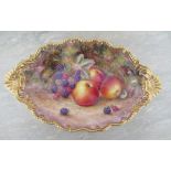 A Royal Worcester oval shaped dish, decorated all over with hand painted fruit by H Ayrton, to a