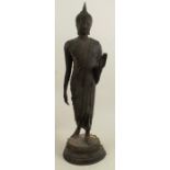 A Thai metal standing figure, of a Buddha, on a circular base, height 25.75ins - Very dirty, looks
