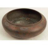 An Oriental bronze bowl or censer, inlaid and painted with figures in an all around landscape,
