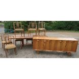 A Gordon Russell style rosewood dining suite, comprising sideboard, with four frieze drawers over