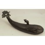 A Japanese bronze model, of a mouse on a long gourd, with lift off section, signed to base, length