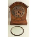 An oak cased chiming mantel clock, with silvered dial, the movement marked PHS for Peter Haas & Son,