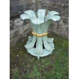 A painted table base of ornate form, raised on casters, diameter 29ins