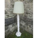 An alabaster standard lamp, having a turned column on a stepped octagonal base, height 36ins