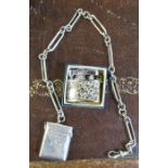 A hallmarked silver vesta case and chain, weight 1oz, together with a lighter