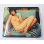 A white metal cigarette case, with engine turned decoration and a panel of a naked  woman