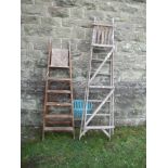 Two wooden step ladders