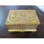 A wooden casket, decorated in gilt with Eastern figures to the hinged lid, the sides with