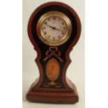 A mahogany cased mantel clock, the dial inscribed Comet, in a balloon case with satinwood inlay,
