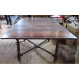 An oak draw leaf table, raised on barley twist legs united by a barley twist stretcher, width