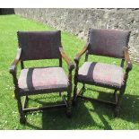 A pair of oak early 18th century style open arm chairs, with tapestry back and seat