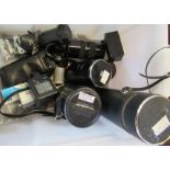 A collection of camera lenses and other items