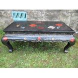 A Chinese style lacquered coffee table, decorated with flowers and birds, Width 18ins, length 38ins,