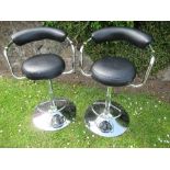 Two chrome and leather kitchen stools, with fire labels