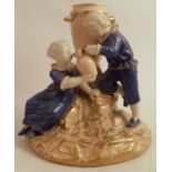 A Royal Worcester figure group, of a girl and boy in mottled blue with the girl drinking from a jug,