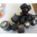 A collection of camera lenses and flashes