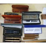 A collection of pens, to include cross and parker