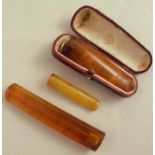 An amber and 9 carat gold cigar holder, makes mark of Adoph Frankeau & Co, Birm, stamped .375 in a