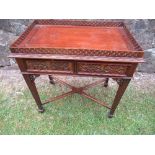 A reproduction Chippendale style silver table, with fretted gallery top, having four blind fret