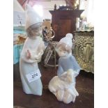 Two Lladro models, a girl holding a chicken and a boy holding a lamb - both are in good condition