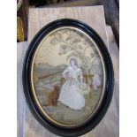Two oval embroidered panels of girls seated, maximum diameter 9.25ins x 5.5ins