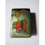 A wooden laquered box, painted with figures in the snow, having red interior, stamped Made in USSR