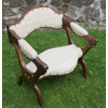 A mahogany and upholstered prayer chair, with hinged top section, on a x base