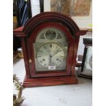 A modern mahogany cased mantel clock, the dial marked C Wood and Son, height 14.25ins