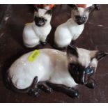 Two Royal Doulton models, of Siamese cats and a Beswick model of a Siamese cat - Condition