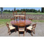 A Reprodux mahogany veneered circular dining table, on central pedestal, diameter 72ins, height