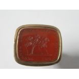 An early 19th century seal fob, the carnelian engraved with a tree propped up by three supports, and