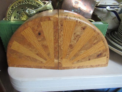 A pair of Arts and Crafts style burr wood book ends, of quadrant shape, possibly Cotswold School