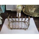 A silver plated novelty toast rack, the ends formed as cricket stub with crickets bats